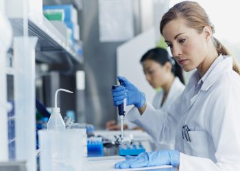 Female scientists working in modern biotechnology laboratory